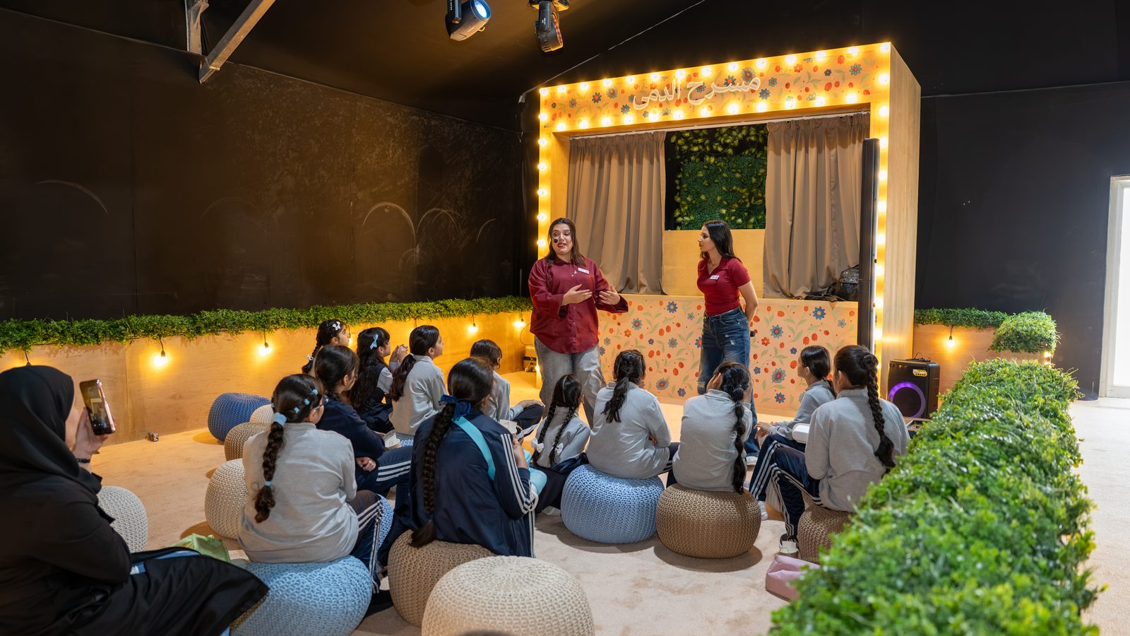 Students around a narrator in the storytelling majlis, Sharjah International Narrator Forum 2026